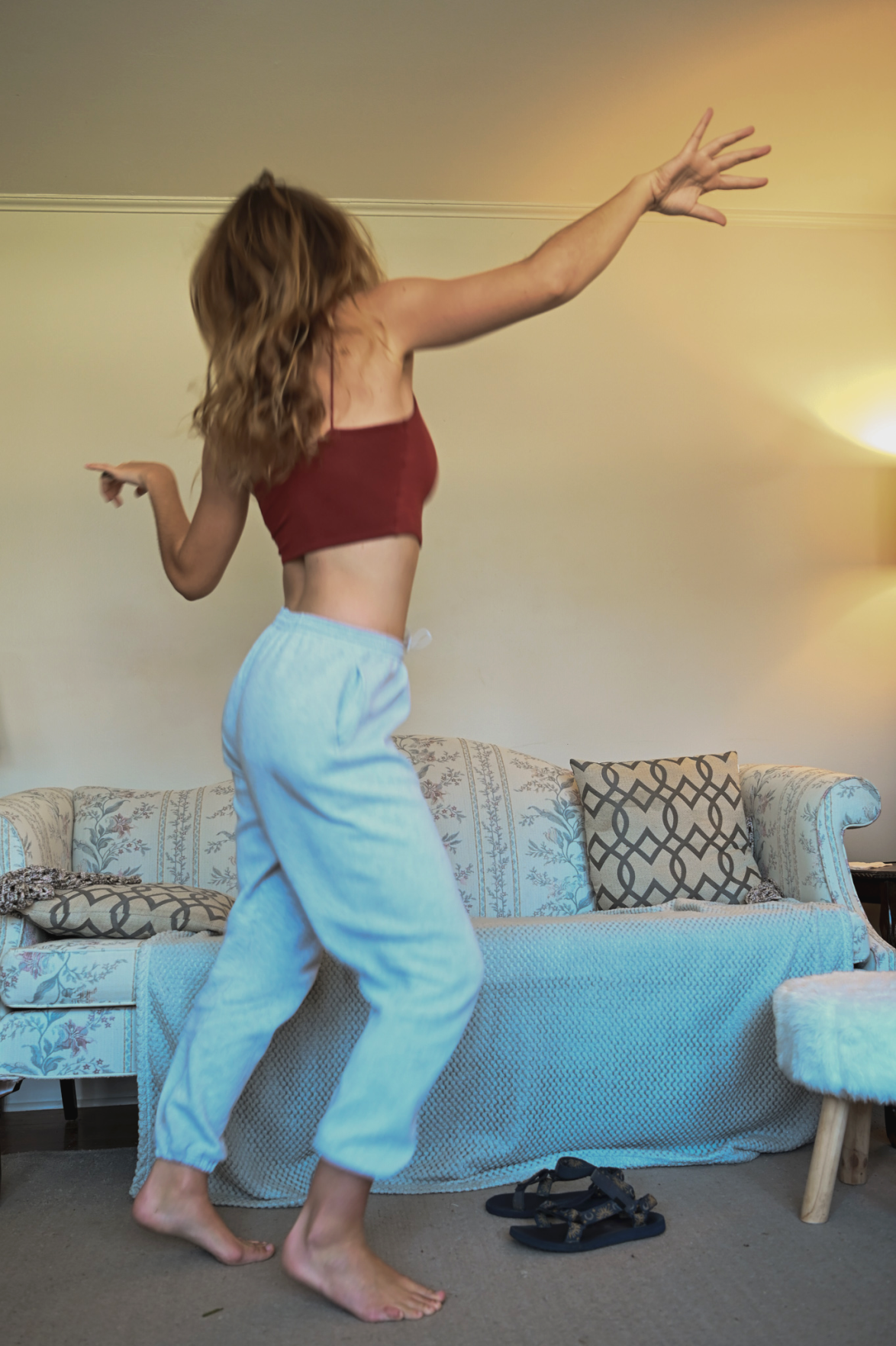Pandemic Photo Essay Girl dancing in a tank top
